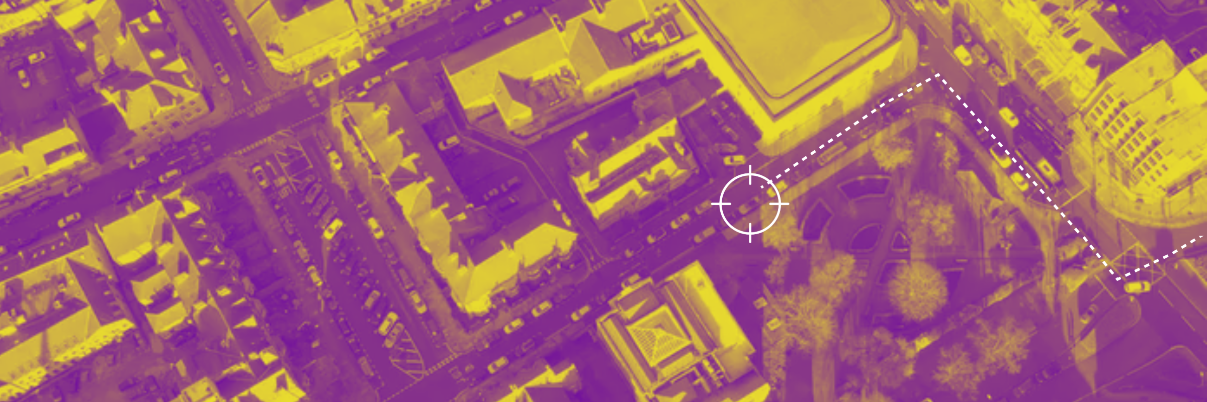 Aerial view of urban area in yellow and purple overlay with a white target mark on the right side. - CSA Catapult