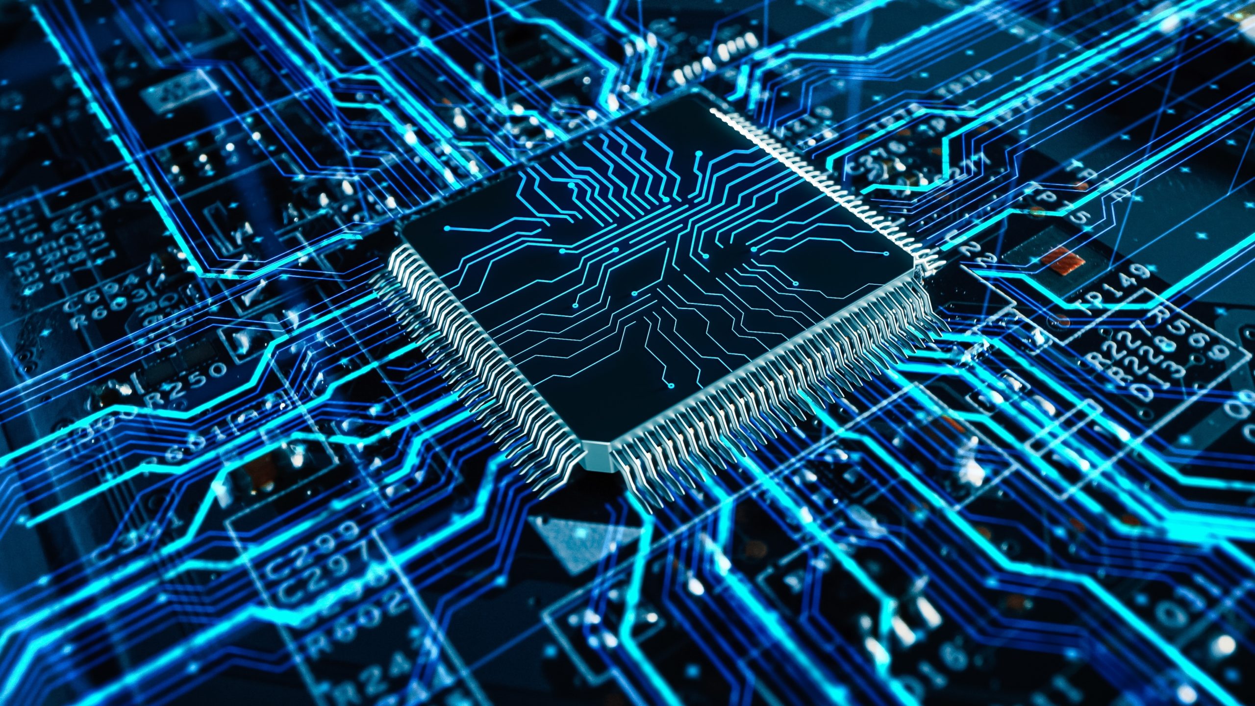 A close-up of a computer microchip with glowing blue circuit lines on a circuit board. - CSA Catapult